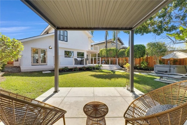 view of patio / terrace featuring french doors and fence