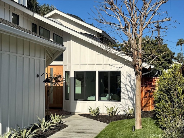 entrance to property featuring board and batten siding