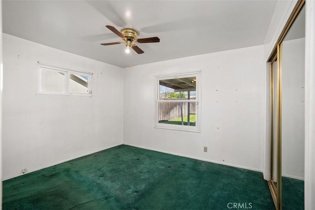 unfurnished bedroom featuring carpet floors, a closet, and a ceiling fan