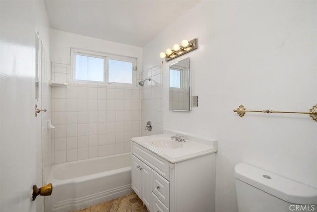 full bath featuring vanity, bathtub / shower combination, and toilet