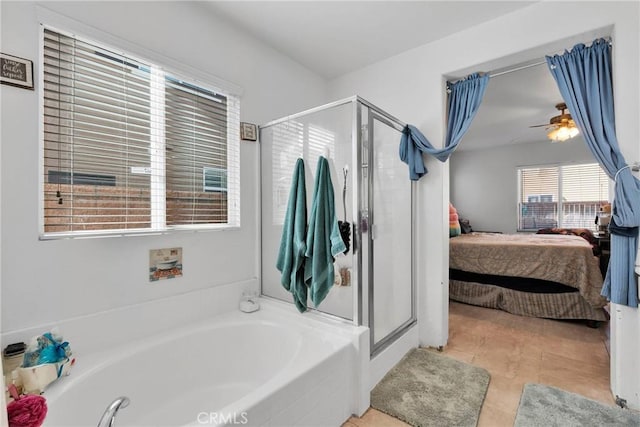 bathroom with ensuite bathroom, a shower stall, a garden tub, and tile patterned floors