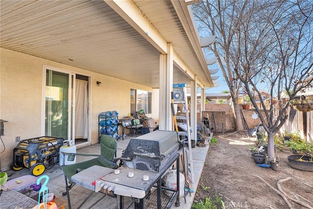 view of patio with fence and grilling area