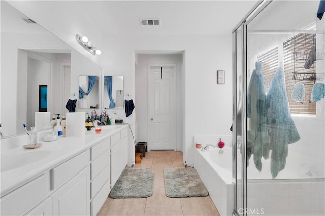 full bath featuring double vanity, visible vents, tile patterned flooring, a shower stall, and a bath