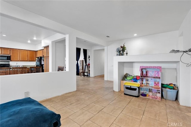 interior space with recessed lighting and light tile patterned flooring