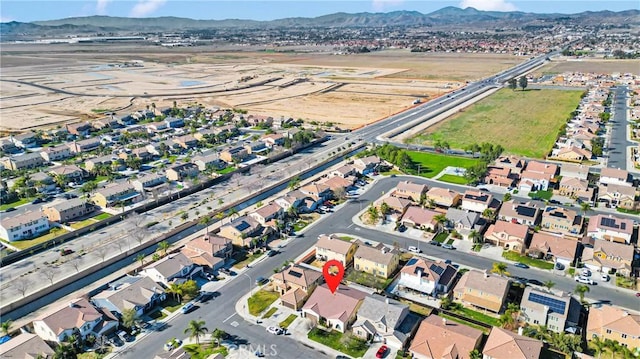 birds eye view of property with a residential view and a mountain view