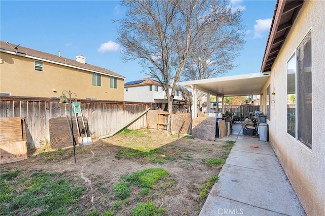 view of yard with a patio area and a fenced backyard