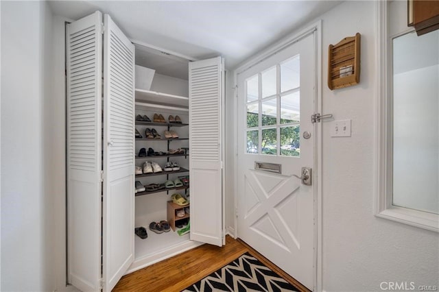 doorway to outside featuring wood finished floors