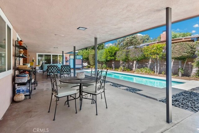 exterior space featuring a fenced backyard and a patio