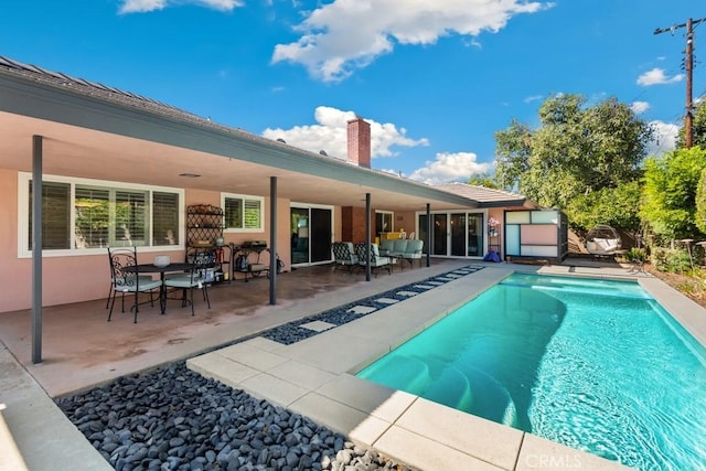 outdoor pool featuring a patio