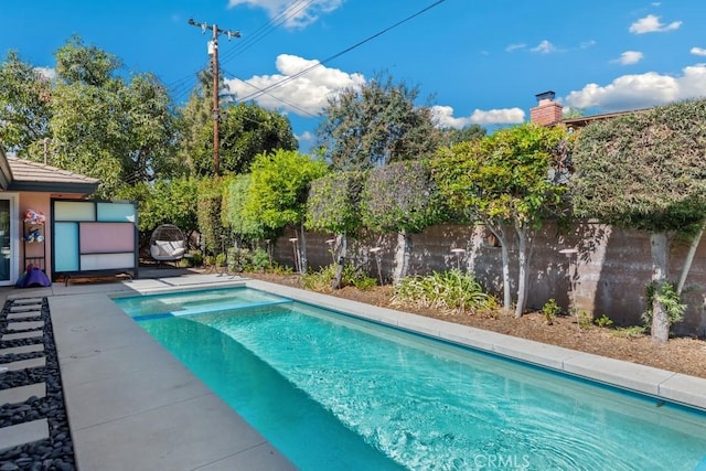 view of pool with a fenced in pool and a fenced backyard