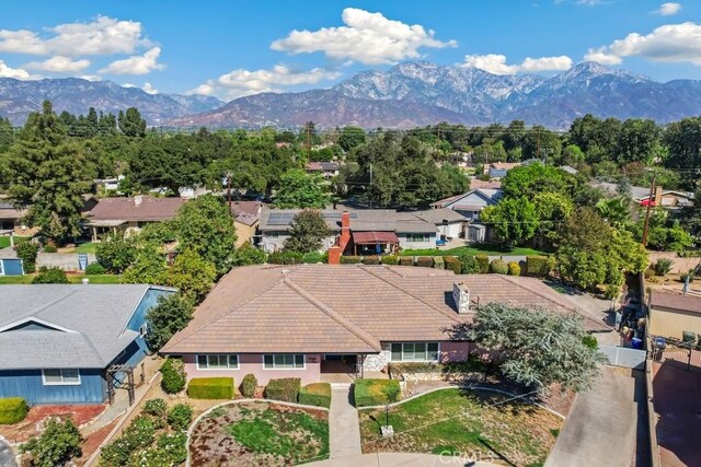 drone / aerial view featuring a residential view and a mountain view