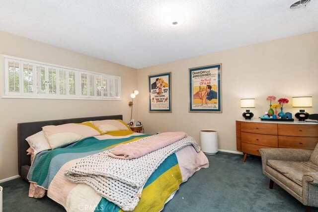 bedroom with carpet, visible vents, a textured ceiling, and baseboards