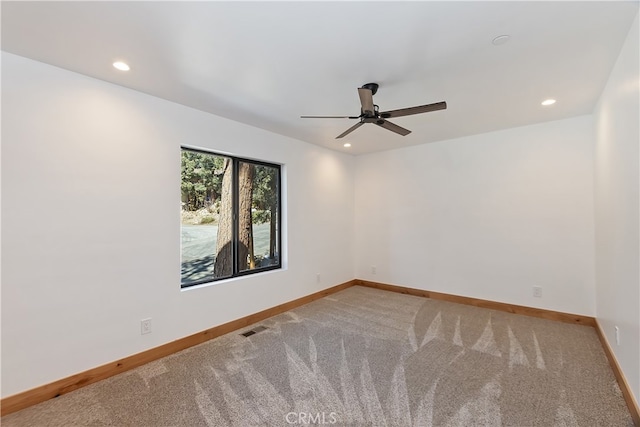 carpeted empty room with recessed lighting, visible vents, ceiling fan, and baseboards