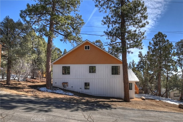 view of home's exterior featuring metal roof