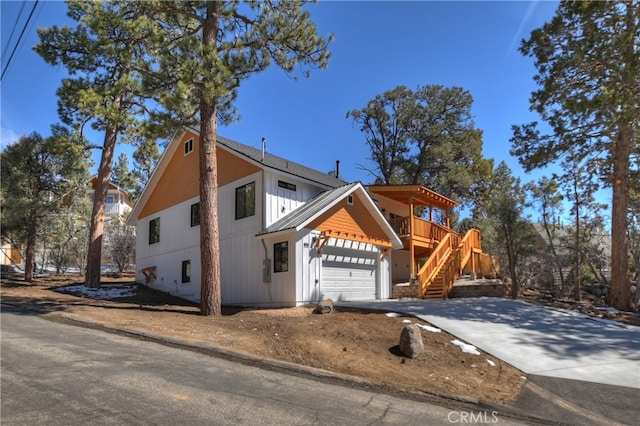 view of front of home with a garage and concrete driveway