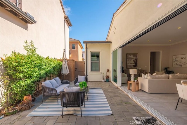 view of patio / terrace with a gate and an outdoor living space