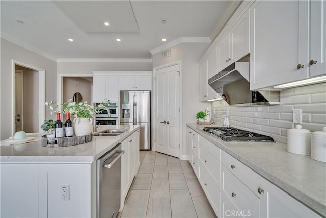 kitchen with visible vents, white cabinetry, ornamental molding, appliances with stainless steel finishes, and decorative backsplash