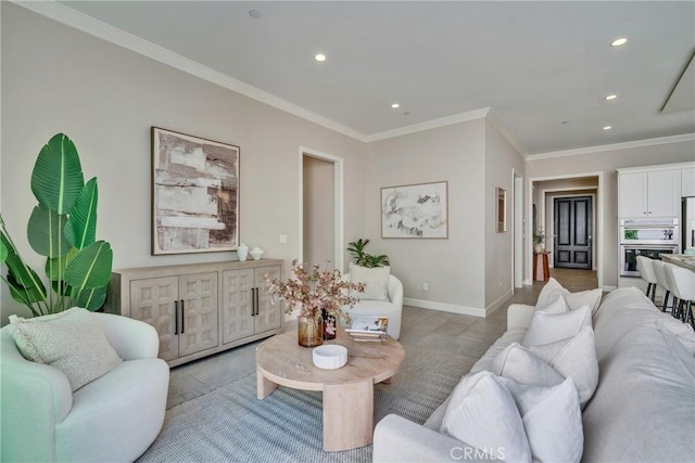 living room with baseboards, ornamental molding, and recessed lighting