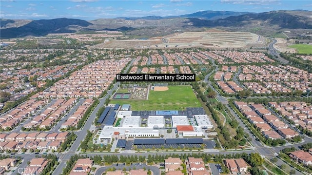 birds eye view of property with a residential view and a mountain view