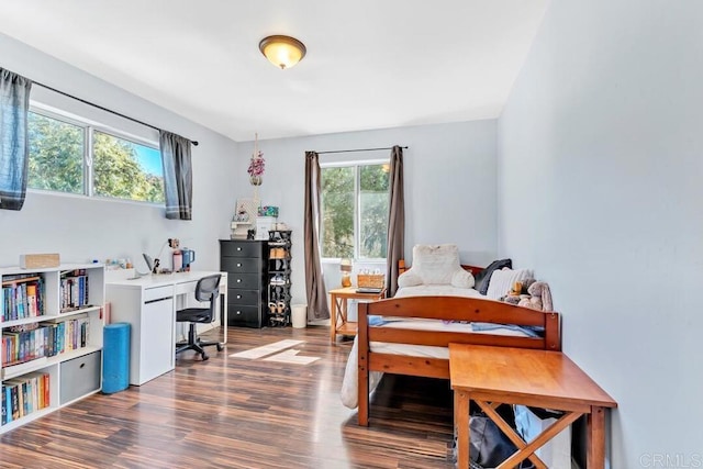 bedroom with wood finished floors