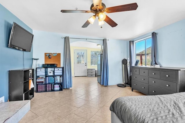 bedroom featuring light tile patterned floors and a ceiling fan