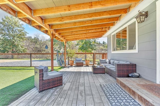 wooden terrace with a yard and outdoor lounge area