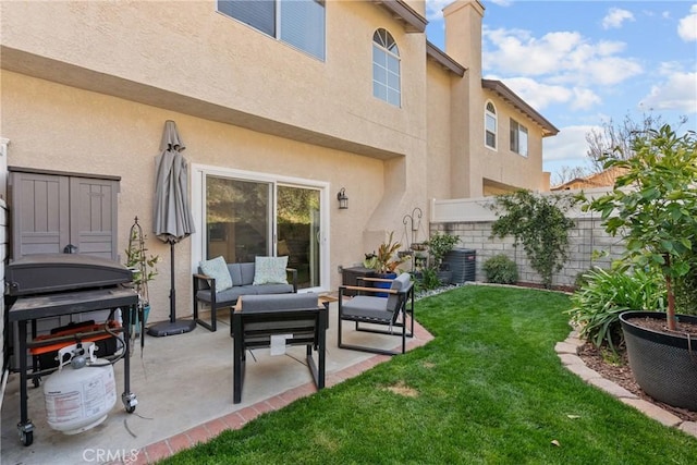 back of property with a lawn, a patio, fence, outdoor lounge area, and stucco siding