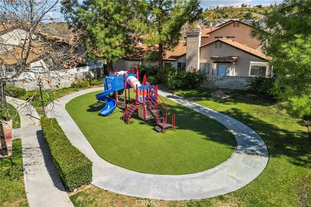 view of play area featuring a lawn