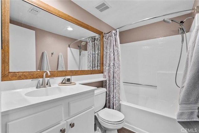 full bath featuring visible vents, vanity, toilet, and shower / bath combo with shower curtain