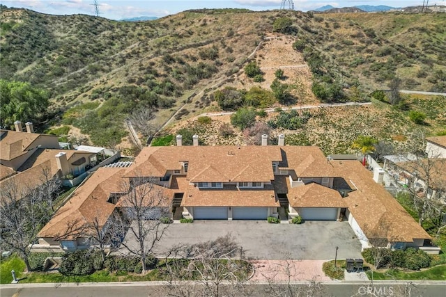 birds eye view of property with a mountain view