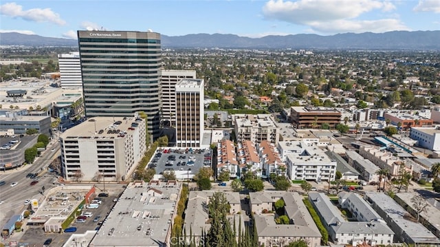 drone / aerial view with a city view and a mountain view