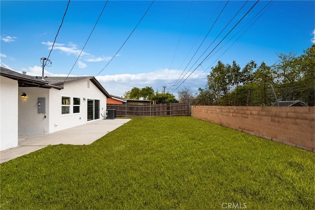 view of yard featuring a patio area, a fenced backyard, and cooling unit