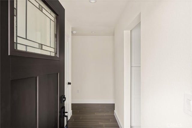 interior space with recessed lighting, dark wood finished floors, and baseboards