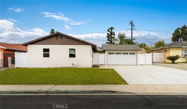 view of side of property with a lawn, fence, a gate, and stucco siding