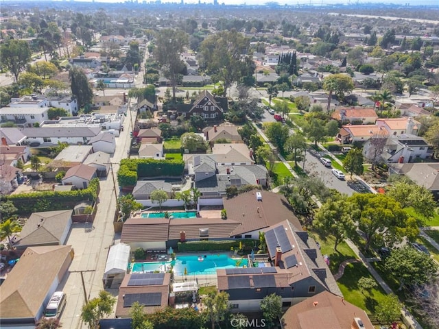 birds eye view of property with a residential view