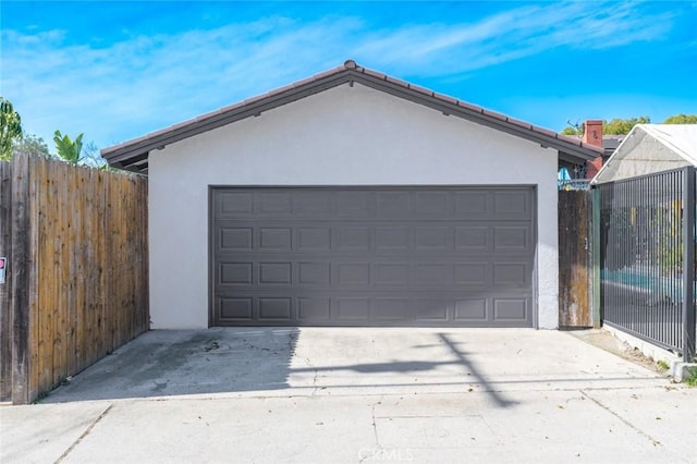 garage with fence