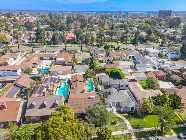 birds eye view of property with a residential view