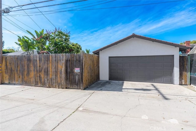 garage with fence