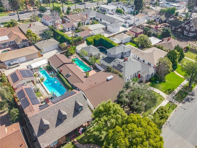 birds eye view of property with a residential view