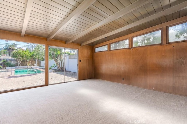 unfurnished sunroom with wood ceiling and lofted ceiling with beams