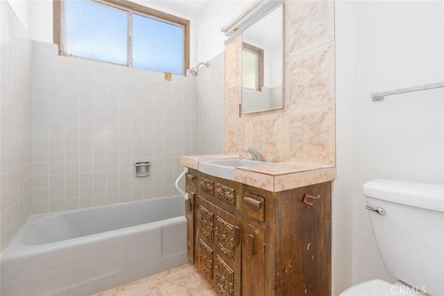 full bathroom with shower / washtub combination, vanity, and toilet