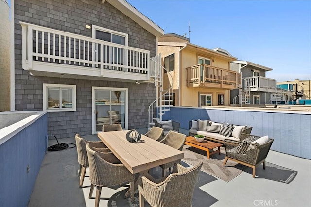 26B Surfside Ave, Surfside, CA 90743 - view of patio featuring an outdoor living space, stairway, a balcony, and outdoor dining area