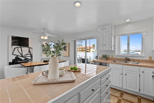 26B Surfside Ave, Surfside, CA 90743 - kitchen featuring tile counters, white cabinetry, recessed lighting, and a ceiling fan