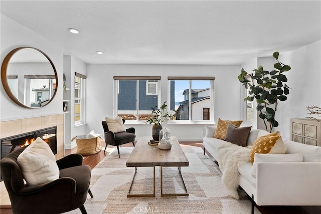 26B Surfside Ave, Surfside, CA 90743 - living room with wood finished floors, a tiled fireplace, and recessed lighting