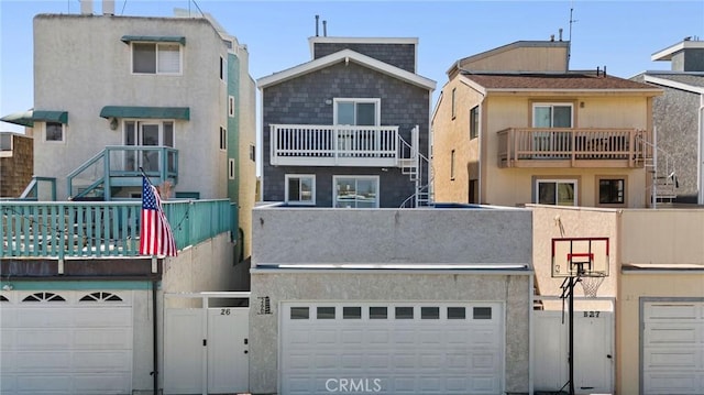 26B Surfside Ave, Surfside, CA 90743 - rear view of property with a gate and a garage