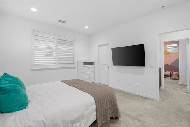 bedroom with baseboards, light colored carpet, recessed lighting, and visible vents