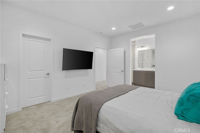 carpeted bedroom with ensuite bath, baseboards, visible vents, and recessed lighting