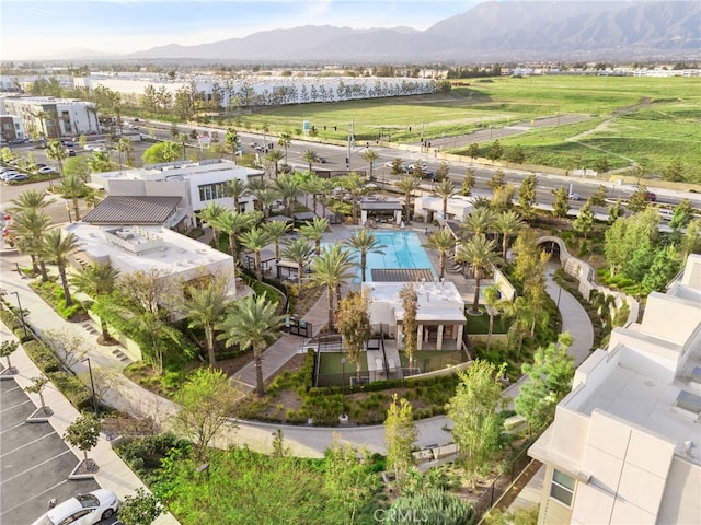 birds eye view of property with a mountain view