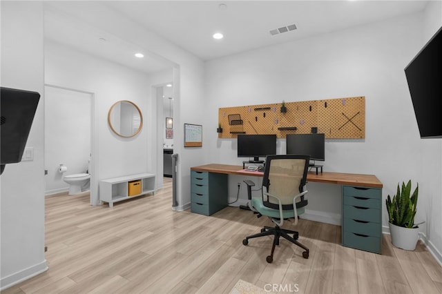 home office featuring baseboards, recessed lighting, visible vents, and light wood-style floors