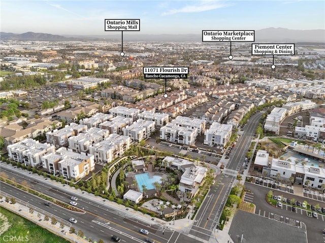 birds eye view of property with a mountain view